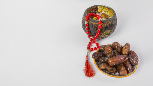 red-prayer-beads-with-fresh-juicy-palm-dates-white-background_23-2148083161
