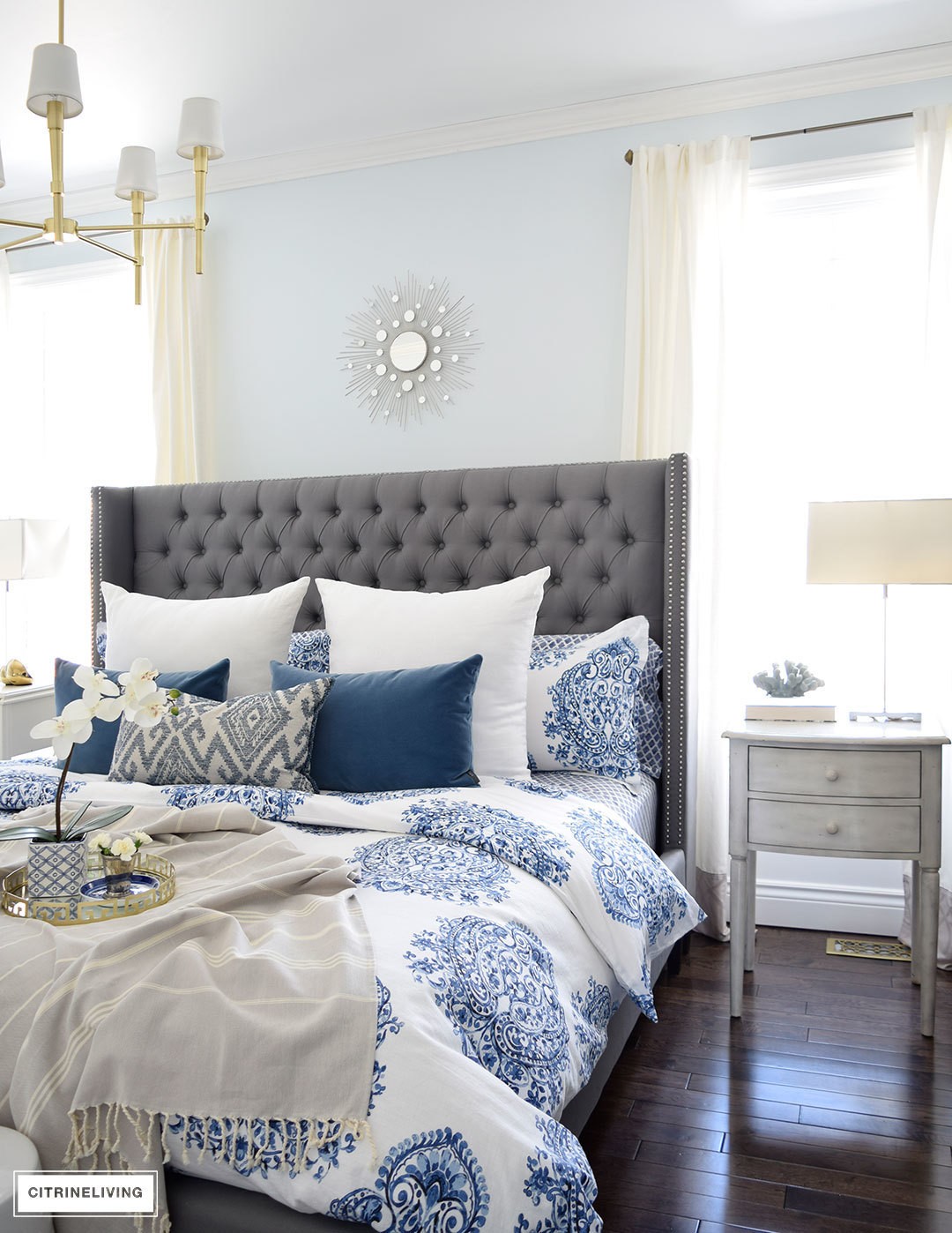 bedroom-blue-and-white-bedding-spring-decor-brass-modern-chendelier-