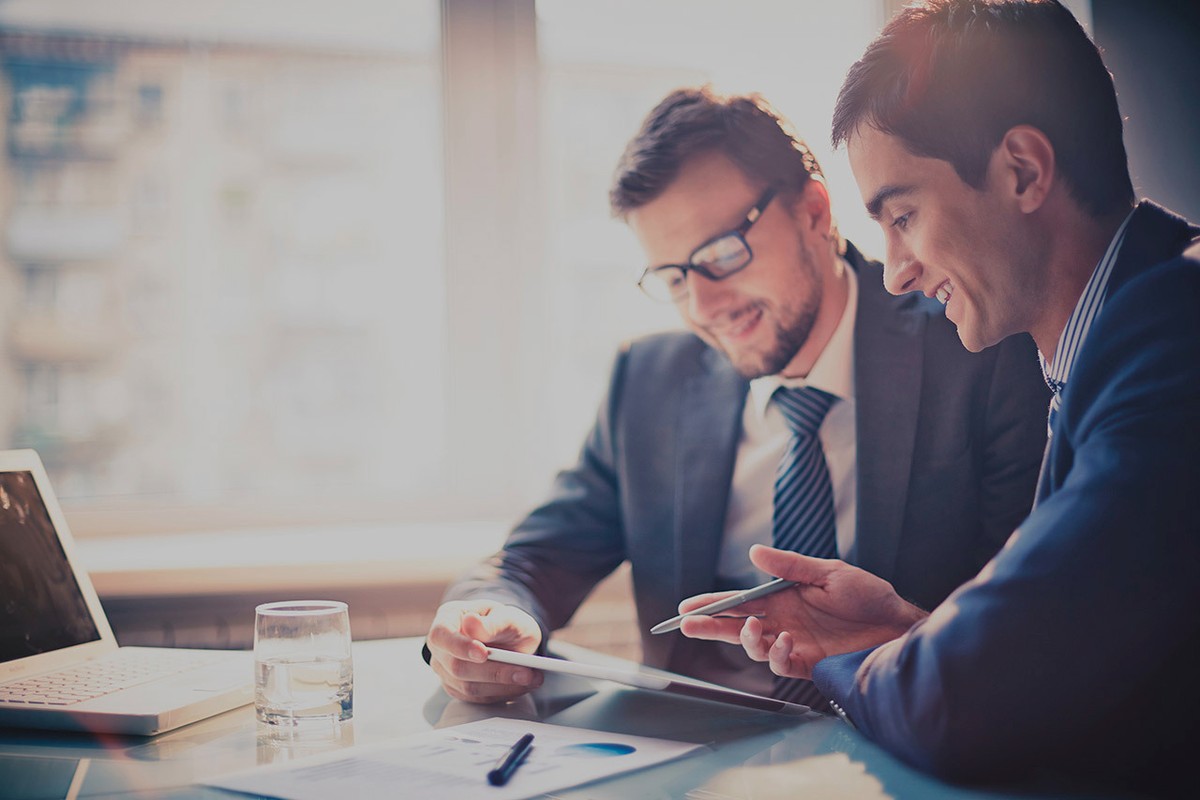 shutterstock-photo-business-men-working-computer-darkened.original